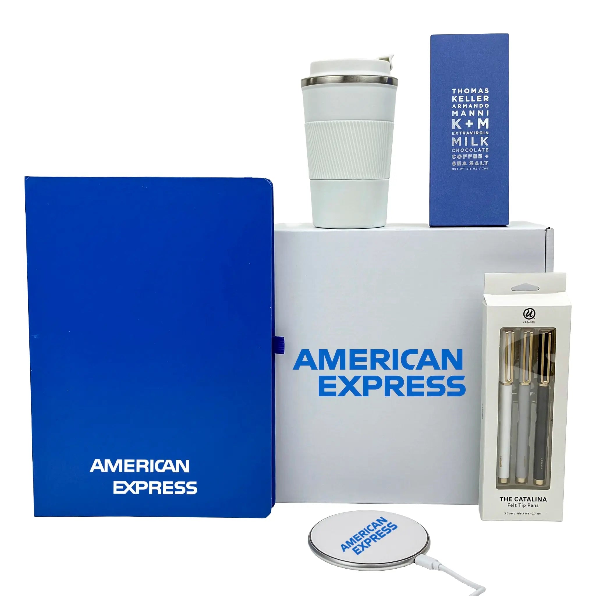 Collection of branded items including a blue notebook, white tumbler, and packaging with 'American Express' branding.