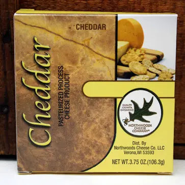 Box of cheddar cheese with a picture of cheese and crackers on a wooden background