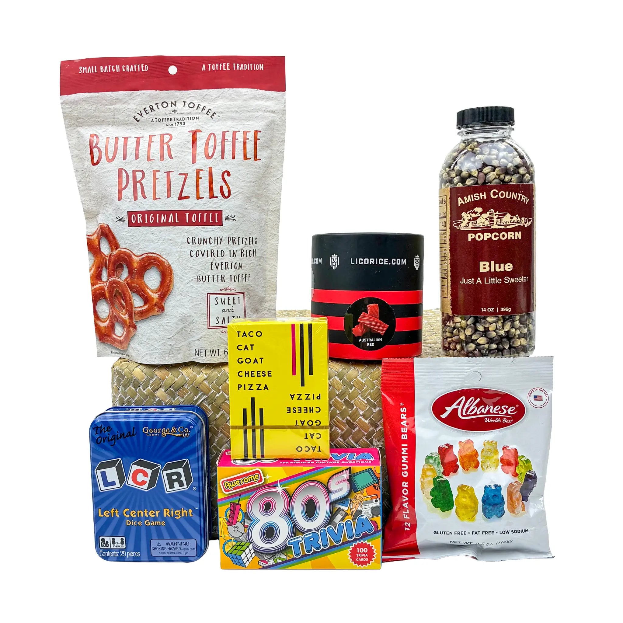 Assorted snack items including pretzels, popcorn, and candy on a white background