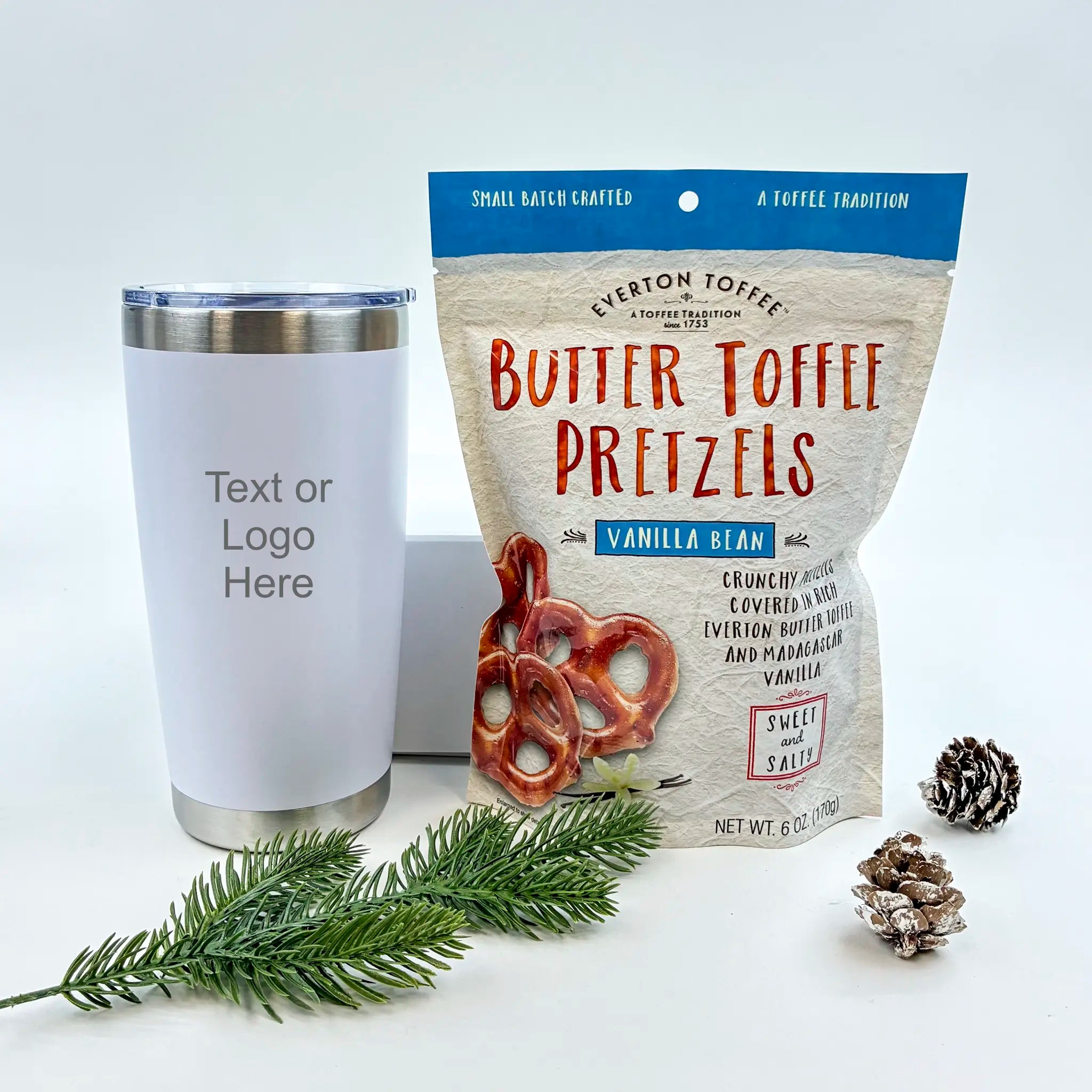 Butter toffee pretzels package with a white tumbler and decorative elements on a light background
