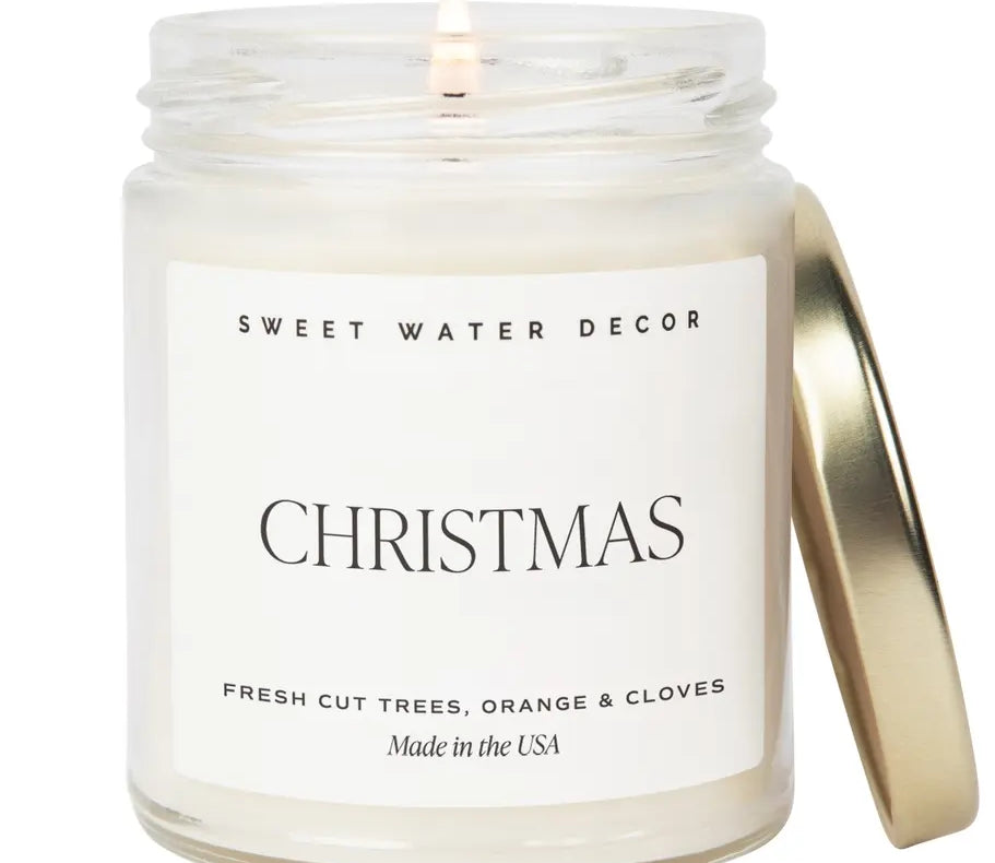 Candle in a jar with 'Sweet Water Decor' label on a white background