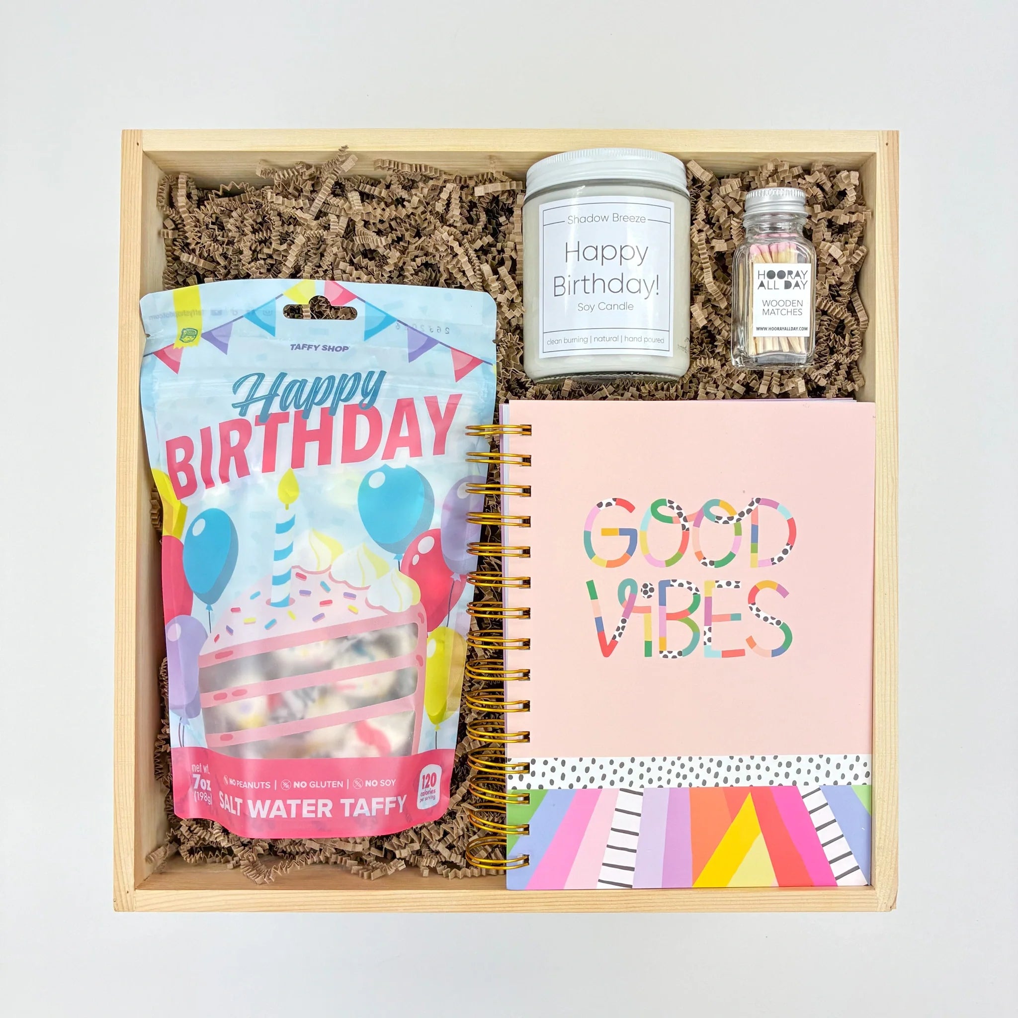 Birthday Party Gift with Candle, Taffy, Matches, and a Journal.