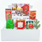 Gift basket with Christmas-themed items including a puzzle, candy, and hot chocolate.