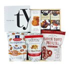 Assorted snack packages including Stroopwafels, Butter Toffee Pretzels, and other treats with a 'Thank You' card.