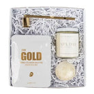 Gift set with gold foil mask, candle, and bath bomb in a box