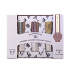 Packaged bitters-infused cocktail cubes with a decorative box on a white background