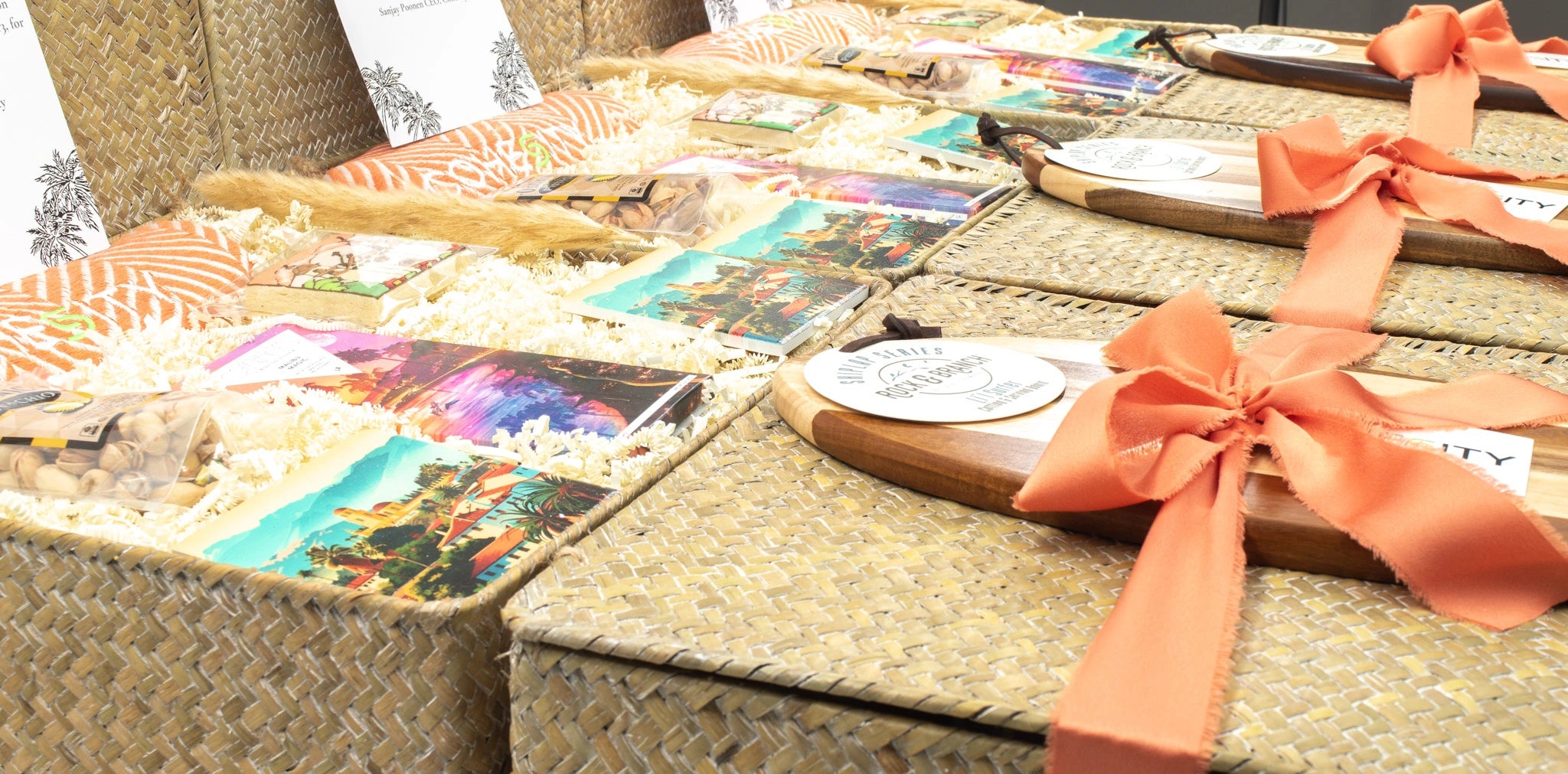 Table with decorative items including cards and a bowl with an orange ribbon.