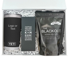 Gift set with YETI tumbler, chocolate bar, and coffee package in a box.
