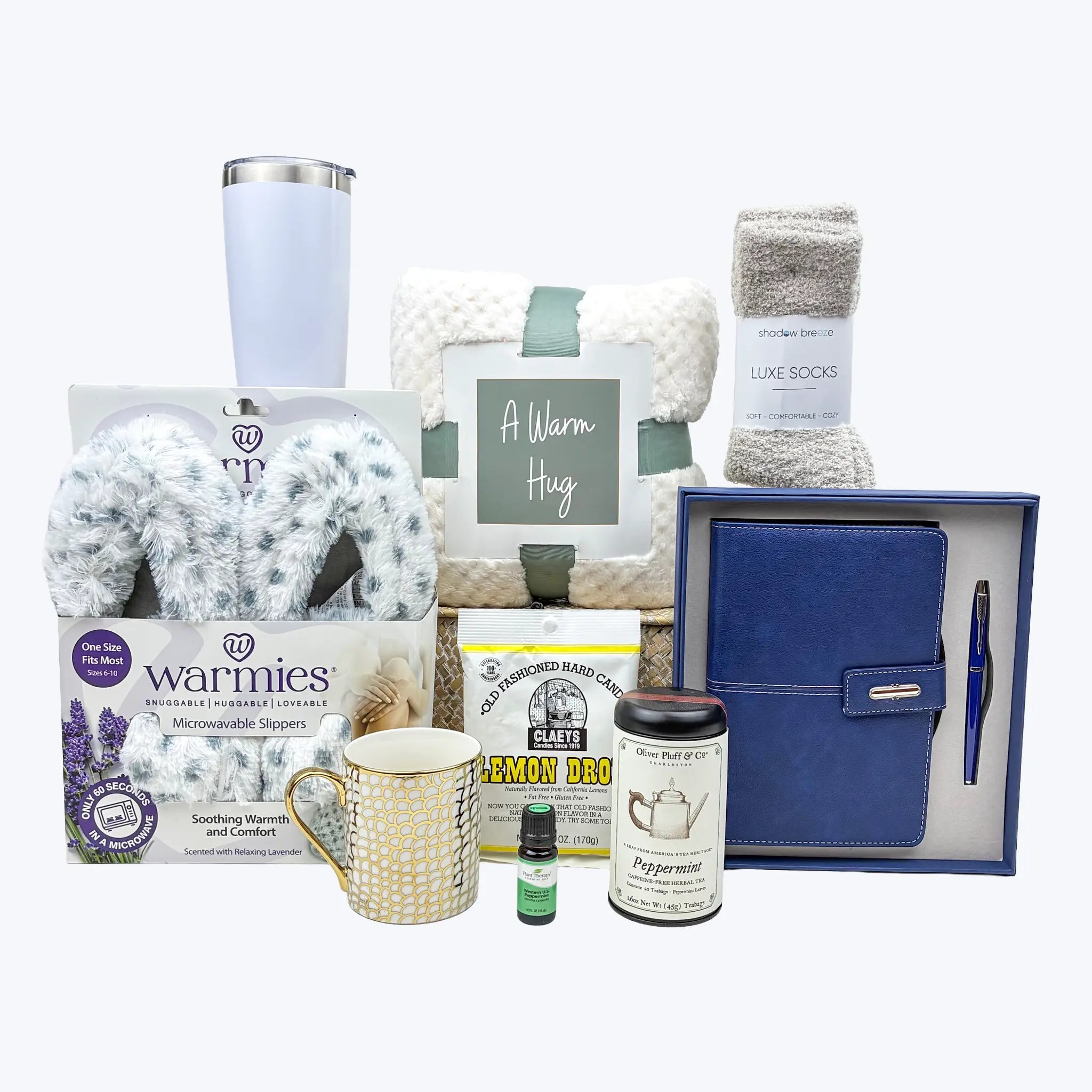 Collection of gift items including a mug, tumbler, and wellness products on a white background