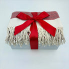 Blanket with red ribbon on a white background