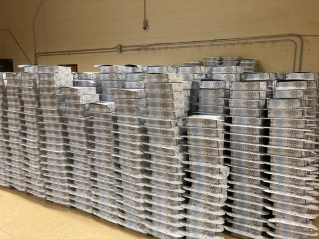 Stacks of holiday branded gifts boxes in a warehouse
