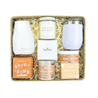 Gift set with candles, body butter, and bath bomb in a box on a white background