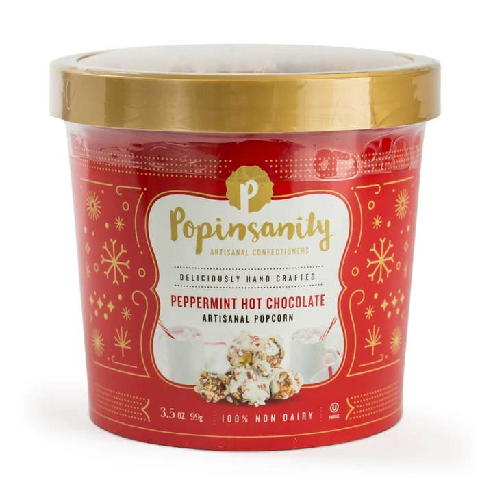 Red container of Popinsanity peppermint hot chocolate popcorn on a white background