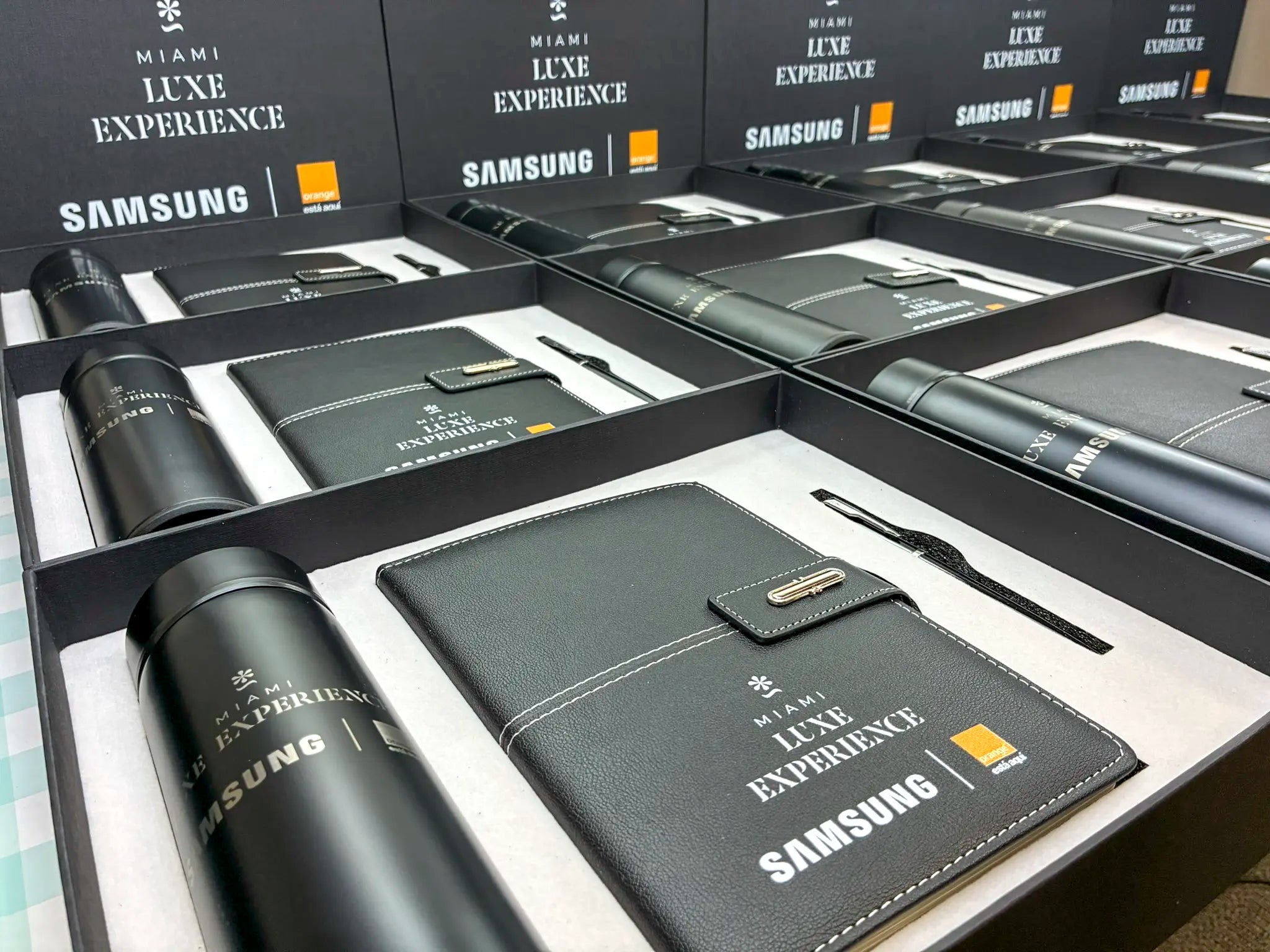Samsung Luxe Experience set with water bottle, pen, and notebook in branded box