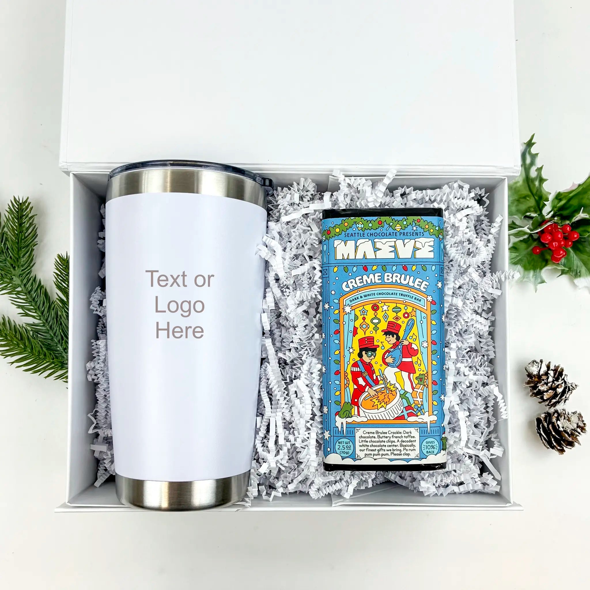 White tumbler and candy bar in a gift box with decorative elements on a white background