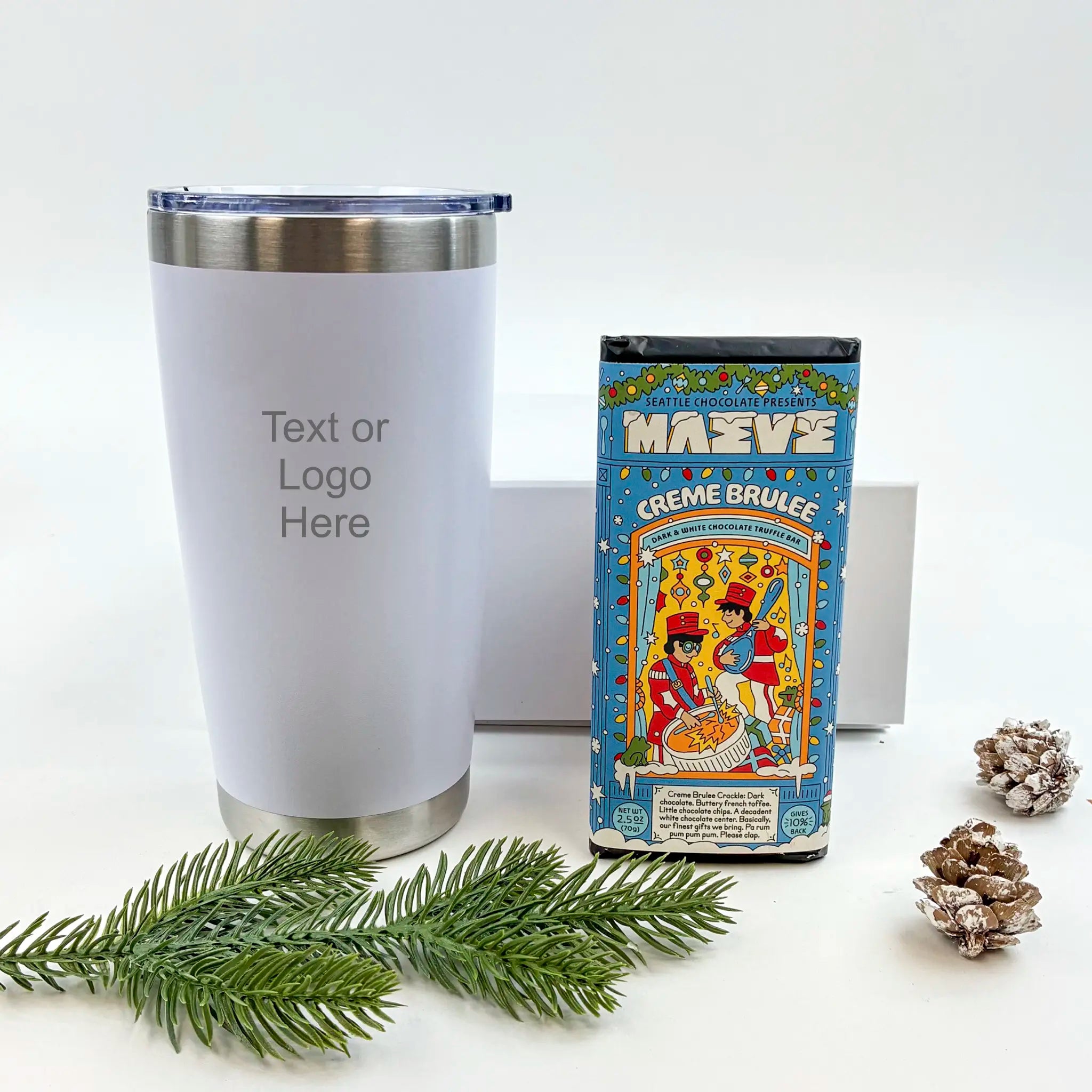 White tumbler with customizable text or logo, next to a vintage-style chocolate box on a white background.