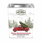 Hot cocoa package with a Christmas truck and tree design on a white background