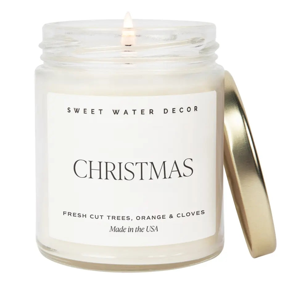 Candle in a jar with 'Sweet Water Decor' label on a white background